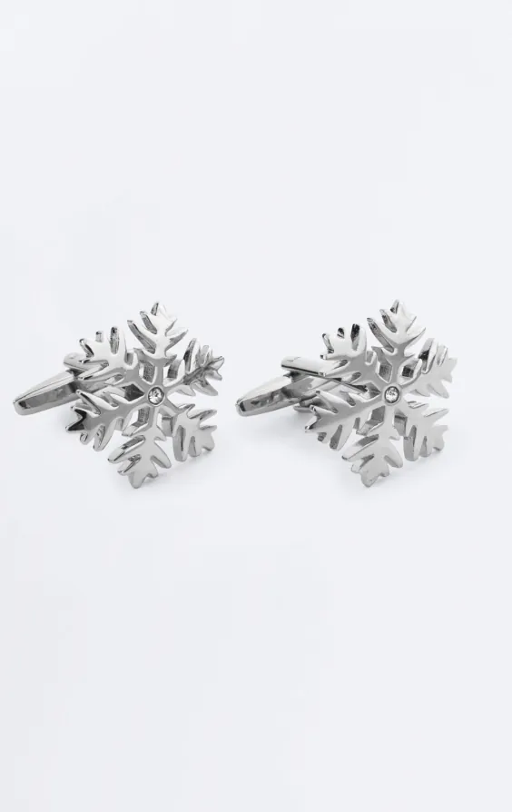Manschettknappar med silverfärgade snöflingor