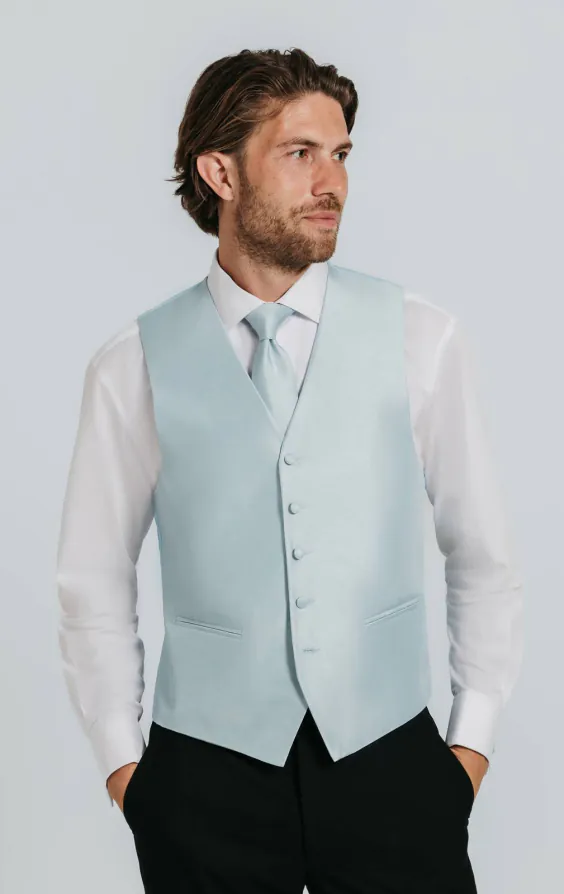 Puderblå väst i polyester dupion