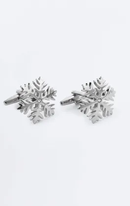 Manschettknappar med silverfärgade snöflingor